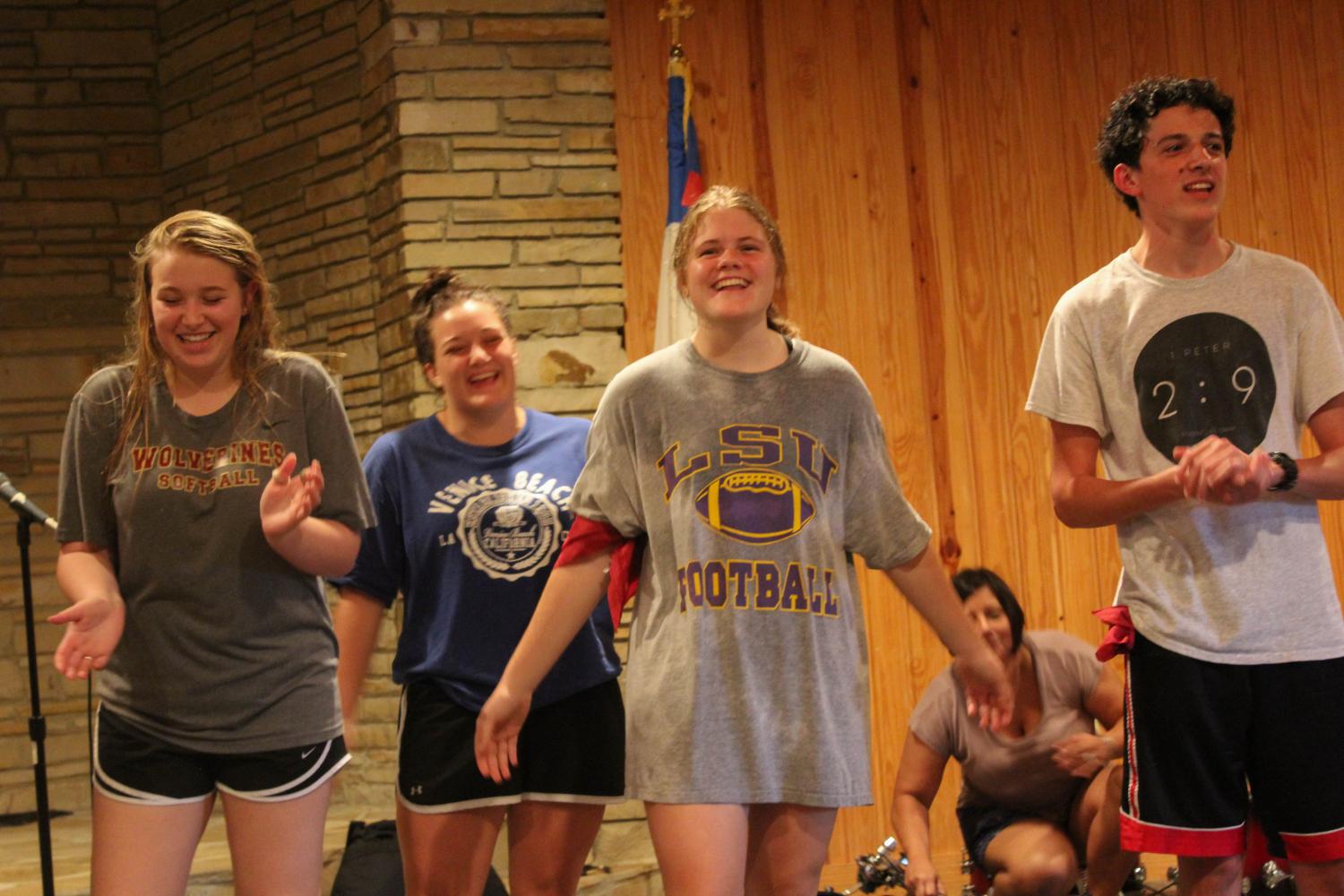 New student Braden Cowart (right) participates in Junior Senior Retreat with fellow Northlake students. Groups from the retreat created cheers and performed them for other groups.