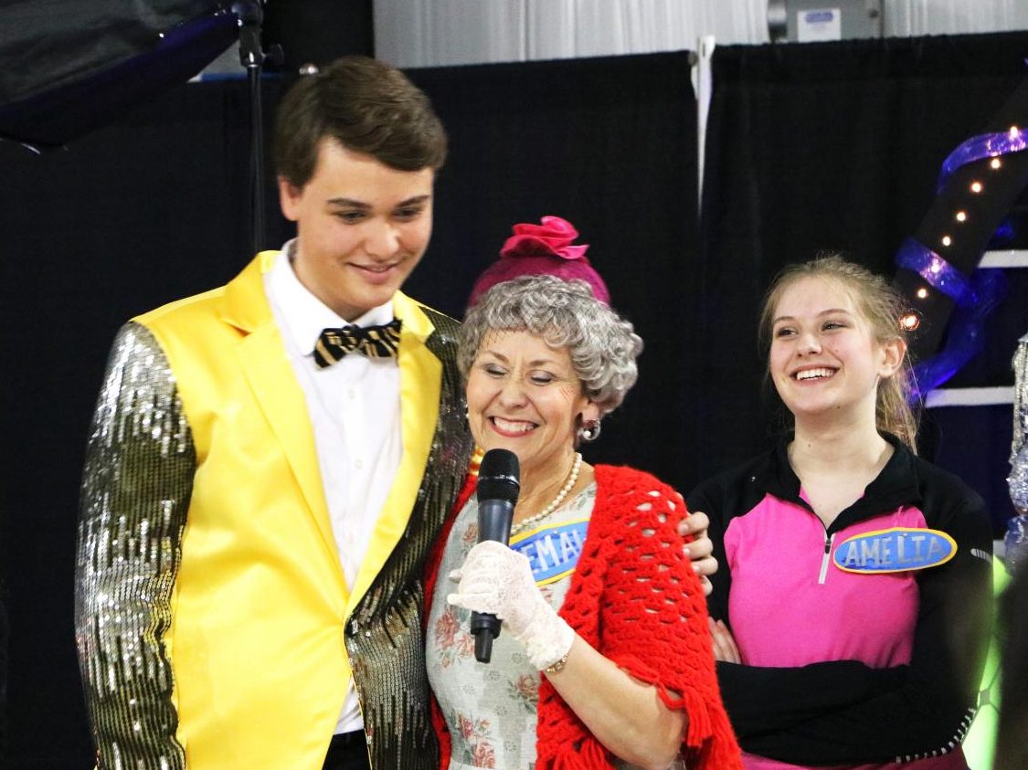 Theatre director Kelann Sigl (center) performs with her son, Northlake alumnus Gabe Sigl (left), and sophomore Halle McKenzie (right) in a dinner theatre April 2017.