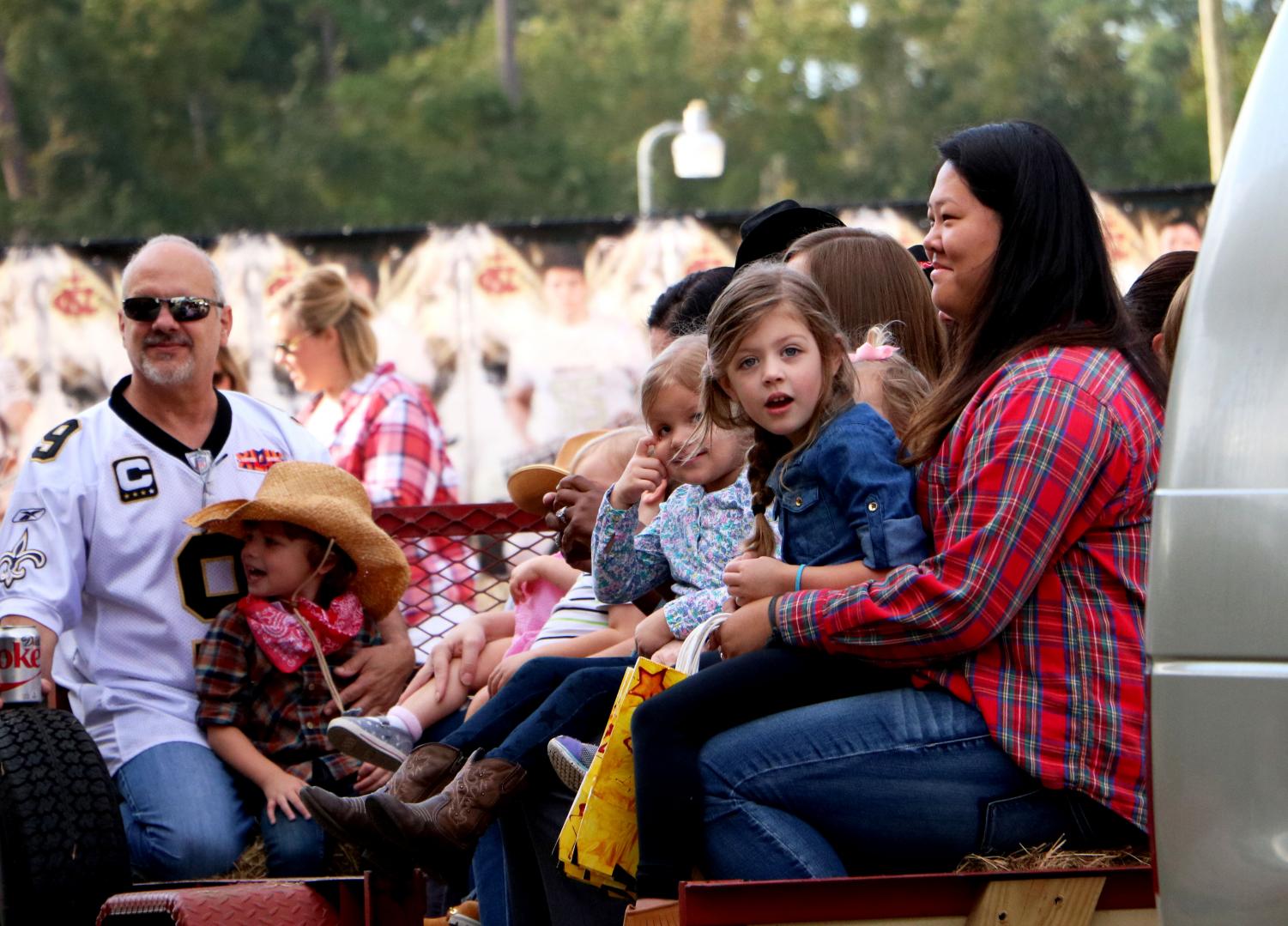 Senior Rory Chappuis sits with a Lower School student during Hee Haw Day.