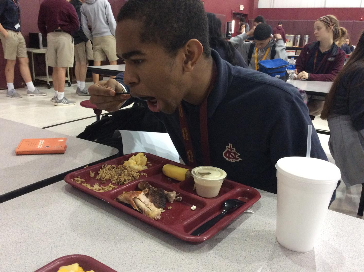 Senior Jordan Armand enjoys lunch cooked by Mr. Don and staff. This is Armand's first year at Northlake.